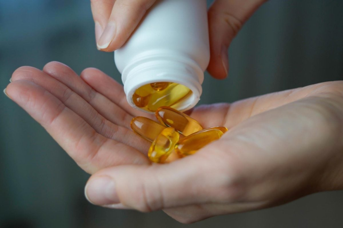 Woman-Pouring-Vitamin-D-Omega-3-Vitamin-Supplements-Hand-1200x800-i69f9275c0976d.jpg